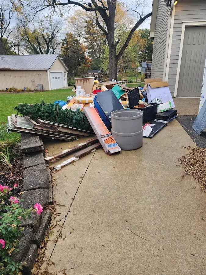 Dumpster being loaded with debris for 3 Yard Dumpster Rental in Green Valley